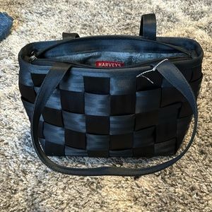 Solid black original seatbelt bag Harvey’s
